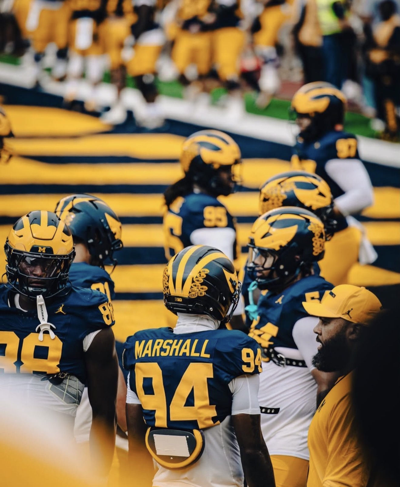 Nate Marshall in his number 94 Michigan uniform viewed from behind